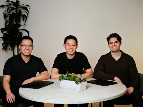 Three men in black shirts sit around a circular table: Meridian CTO George Fang, CEO John Ling and COO Zach Kirshner