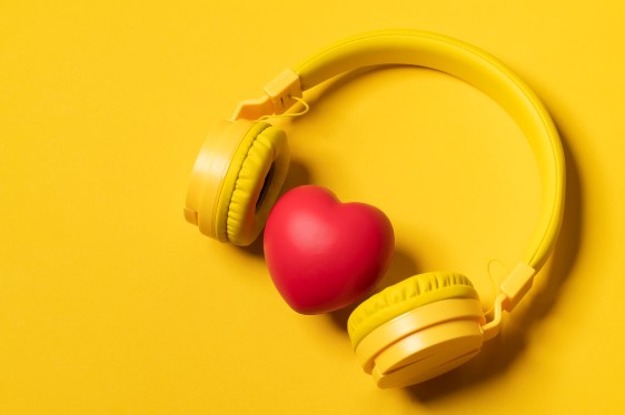 Yellow Headphones On Yellow Background And A Heart