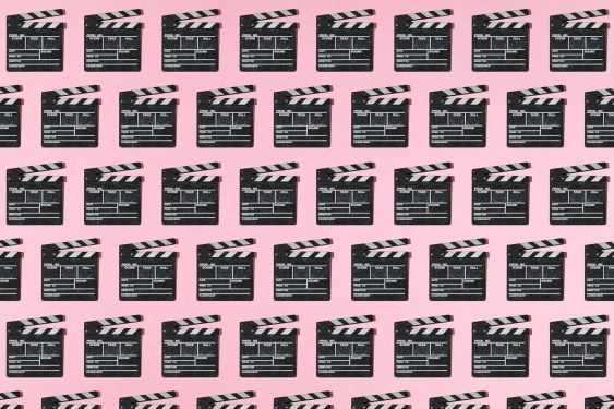 Wooden old movie clapperboard pattern with hard shadow on pink background. Concept of film industry, cinema, entertainment, and Hollywood.