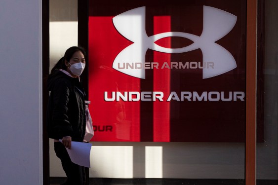 A pedestrian walks past an Under Armour store on January 9, 2023 in Beijing, China.
