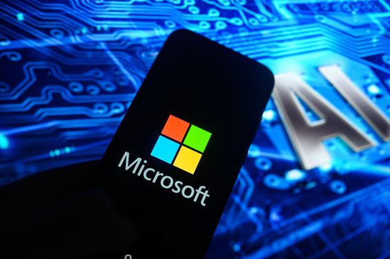 Image of a smart phone with the Microsoft logo on it with "AI" in the background, Nscale
