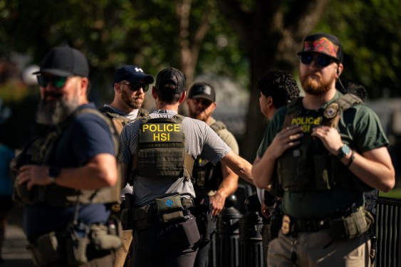 Agents from the US Immigration and Customs Enforcement's Homeland Security Investigations (HSI) unit, US Park Police officers, and US Secret Service Uniformed Division officers during a traffic stop near the White House in Washington, DC, US, on Tuesday, Aug. 26, 2025. President Donald Trump threatened that prosecutors would seek the death penalty for anyone found guilty of murder in Washington, DC, a move that would escalate his crime crackdown in the nation's capital. Photographer: Al Drago/Bloomberg via Getty Images