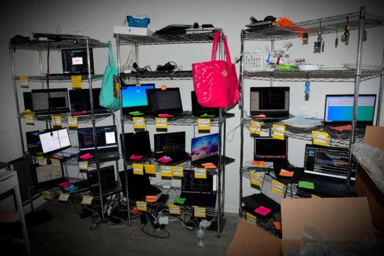 a photo of a laptop farm, in the case of Christina Chapman, who was convicted for helping North Koreans gain employment at U.S. companies.