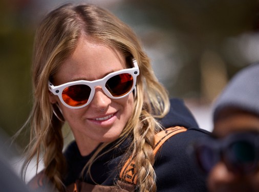 young woman wearing Meta Oakley smart glasses