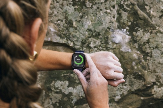 woman checking her smartwatch