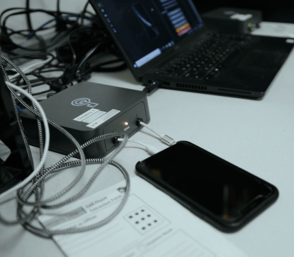 A man operates a Graykey phone hacking and unlocking device, made by Magnet Forensics. (Image: Magnet Forensics)